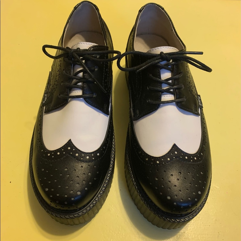 Rose g. platform saddle shoes.